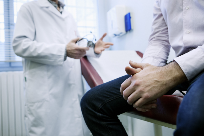 Man Consulting With Doctor - AndroNeo Hospitals