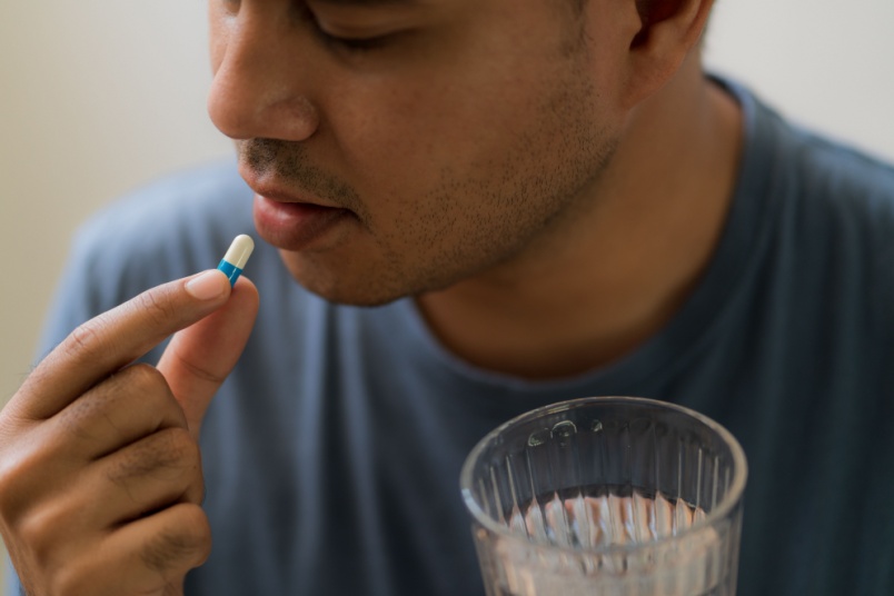 Man taking pill - AndroNeo Hospital